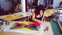 Image of Favianna Rodriguez creating art work.